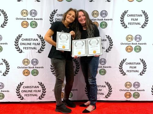 Christian Film Festival (CFF) August 2022 awards Best Music Video & best Song. Lynnmarie Hinerman & Tammy Thompson. Smile & joyful.